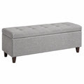 Banc coffre rectangulaire 110 x 40 x 45 cm en polyester gris avec pieds en bois d'hévéa et structure MDF