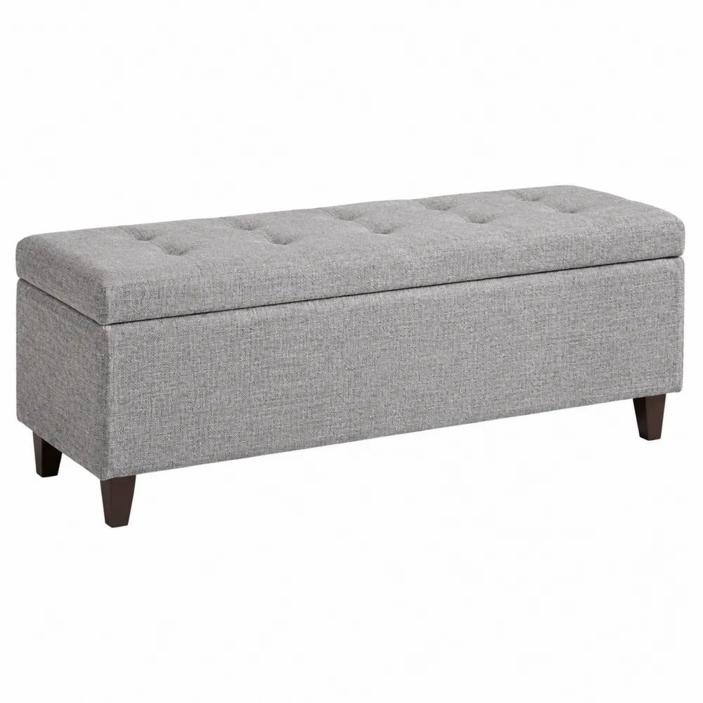 Banc coffre rectangulaire 110 x 40 x 45 cm en polyester gris avec pieds en bois d'hévéa et structure MDF